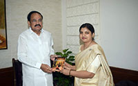 Dr. Molishree (IES:2011) presenting her book 'Aritrika' to Honorable Vice President